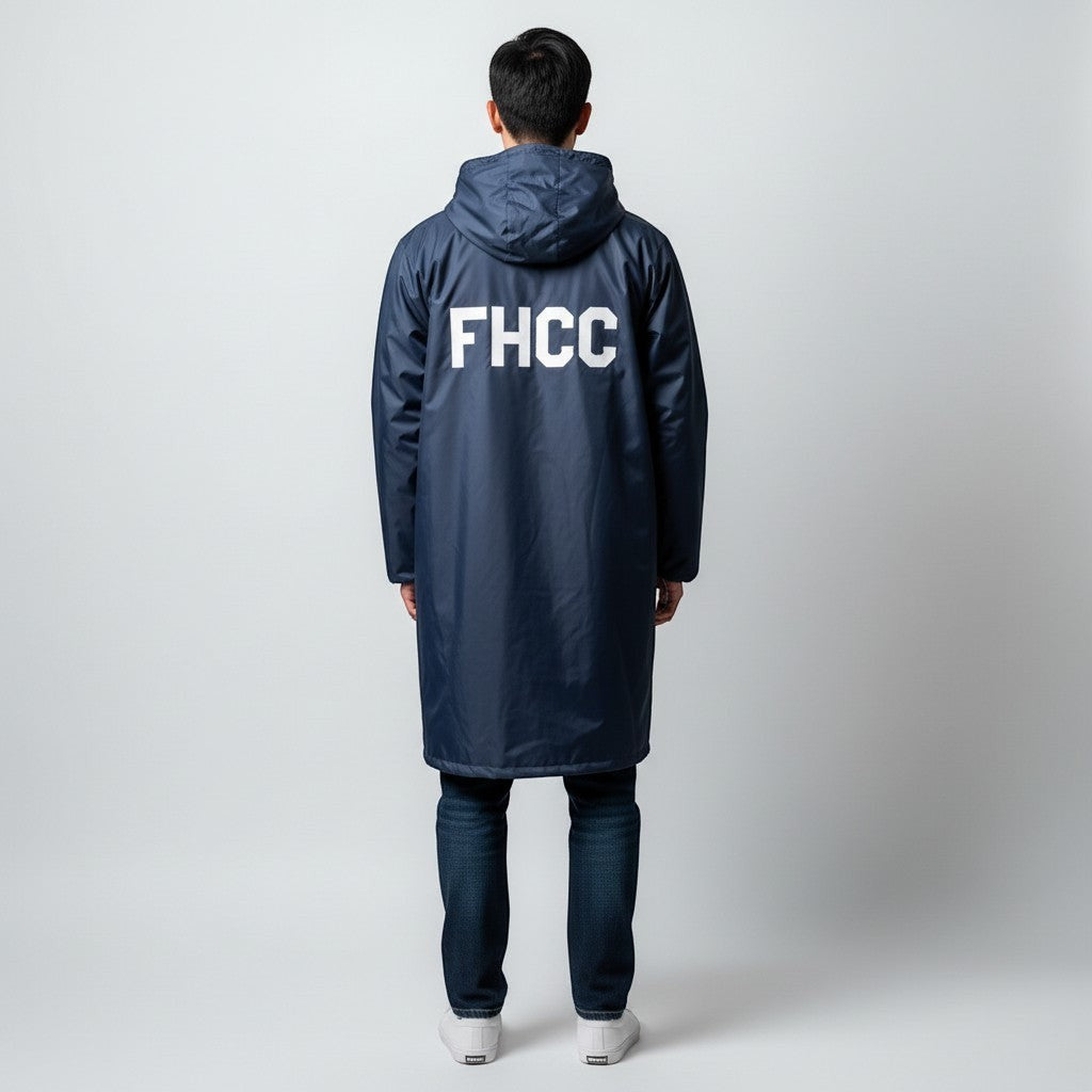 The Swim Guy Online Store navy parka with hood and white FHCC block letters on the back, worn by a man