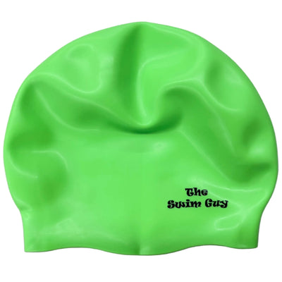Green swim cap with 'The Swim Guy' logo on a gray surface