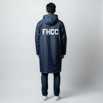 The Swim Guy Online Store navy parka with hood and white FHCC block letters on the back, worn by a man