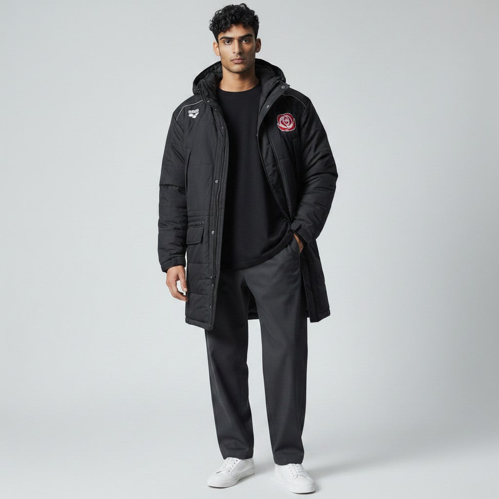 The Swim Guy Online Store black quilted parka with Rose Bowl Aquatics logo on chest and back, drawstring hood, and reflex taping.